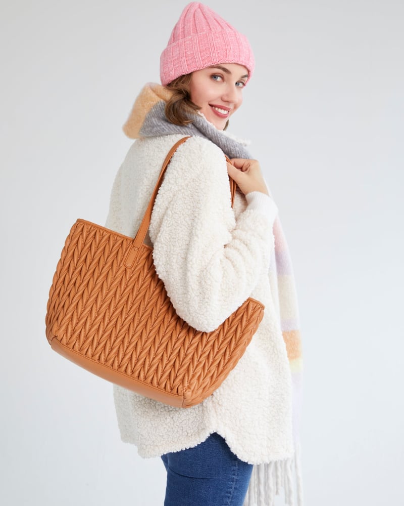 Side of a model wearing a size One Size Jody Tote in Tan by Shiraleah. | dia_product_style_image_id:309178